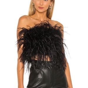 Never worn Feather top zips in the back from Revolve